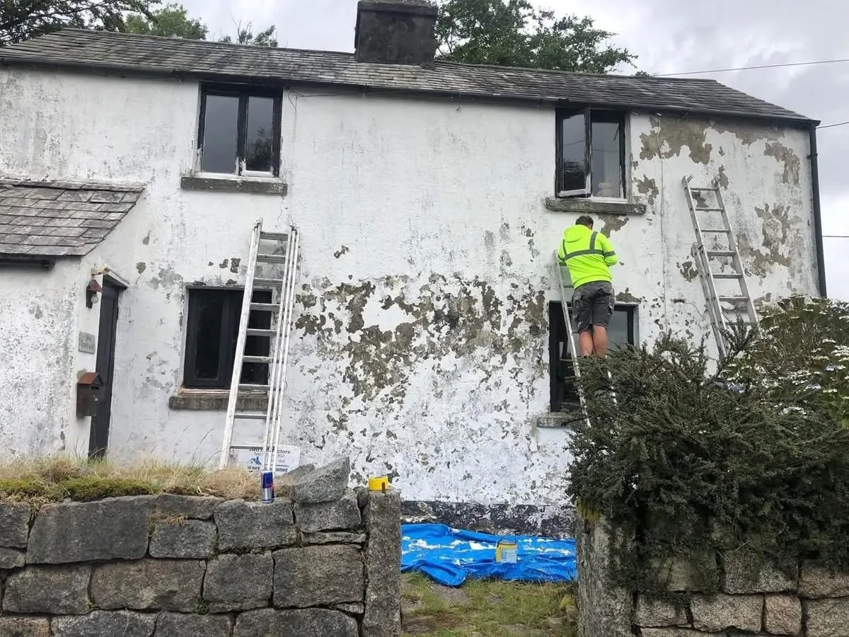 Cottage with blown, flaking render before repair in St Just
